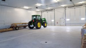 Tractor in Heated Warehouse Space